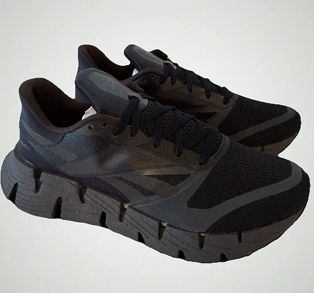 Reebok Floatzig Everyday Neutral Straßenlaufschuhe schwarz/braun Damen UK 7